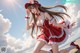 A woman in a red and white dress and hat on the beach.