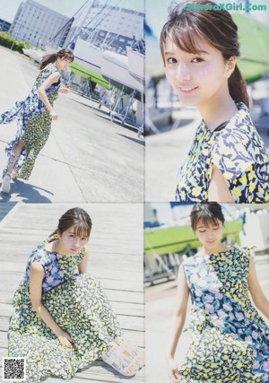 A woman in a blue and yellow dress posing for a picture.